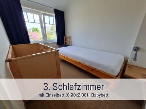 Kinderzimmer mit einem Bett - Ferienhaus Kornblume